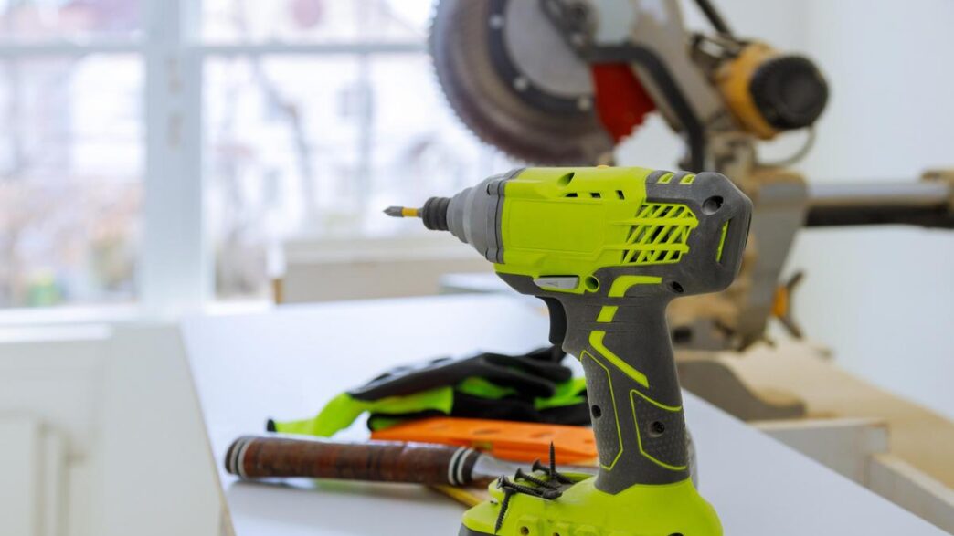 A well-organized home workshop featuring advanced cordless power tools on a polished workbench.